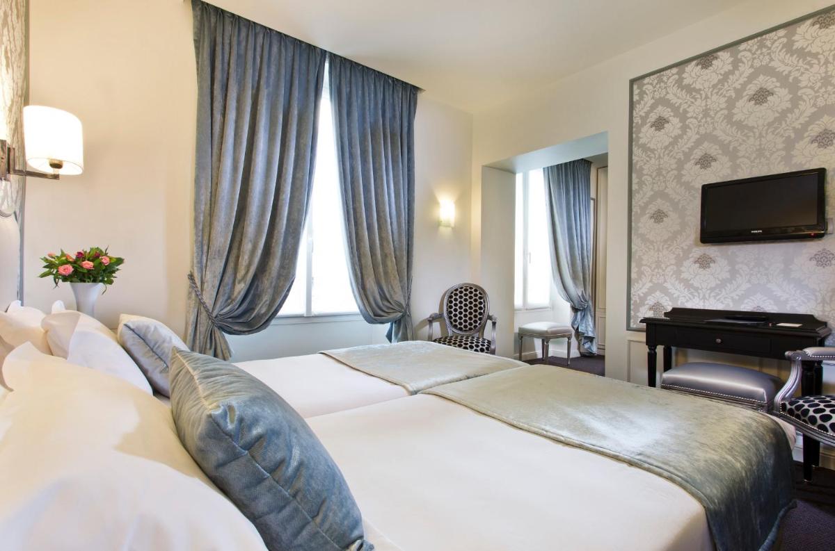 Un ou plusieurs lits dans un hébergement de l'établissement Hôtel Saint-Pétersbourg Opéra & Spa