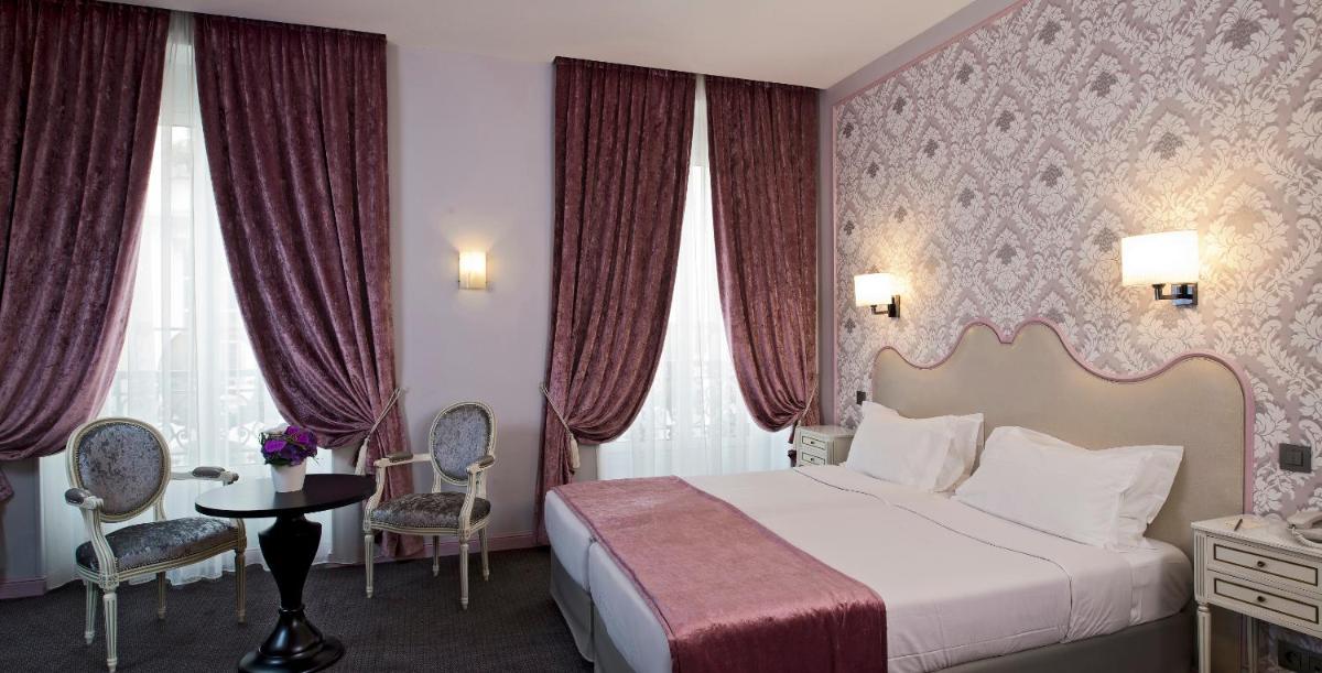 Un ou plusieurs lits dans un hébergement de l'établissement Hôtel Saint-Pétersbourg Opéra & Spa
