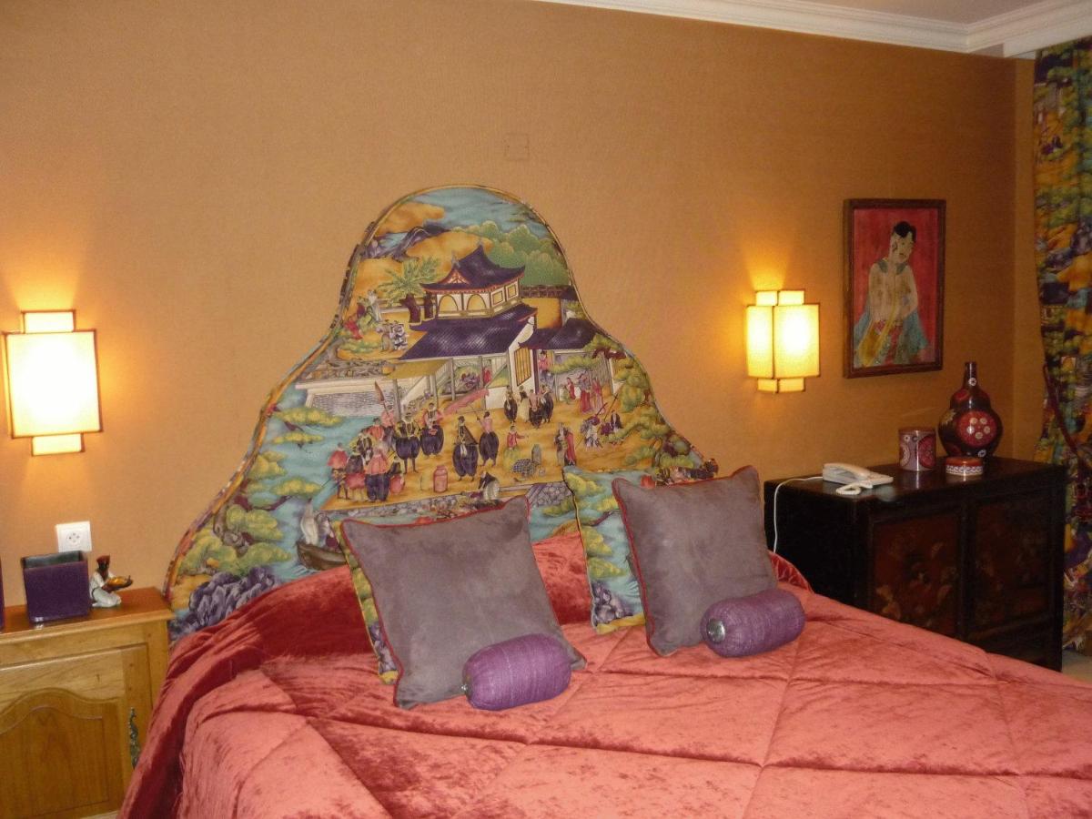 Un ou plusieurs lits dans un hébergement de l'établissement Hotel De France