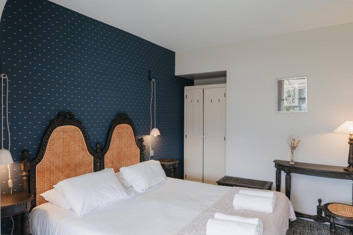 Un ou plusieurs lits dans un hébergement de l'établissement Hôtel La Robéyère - BW Signature Collection