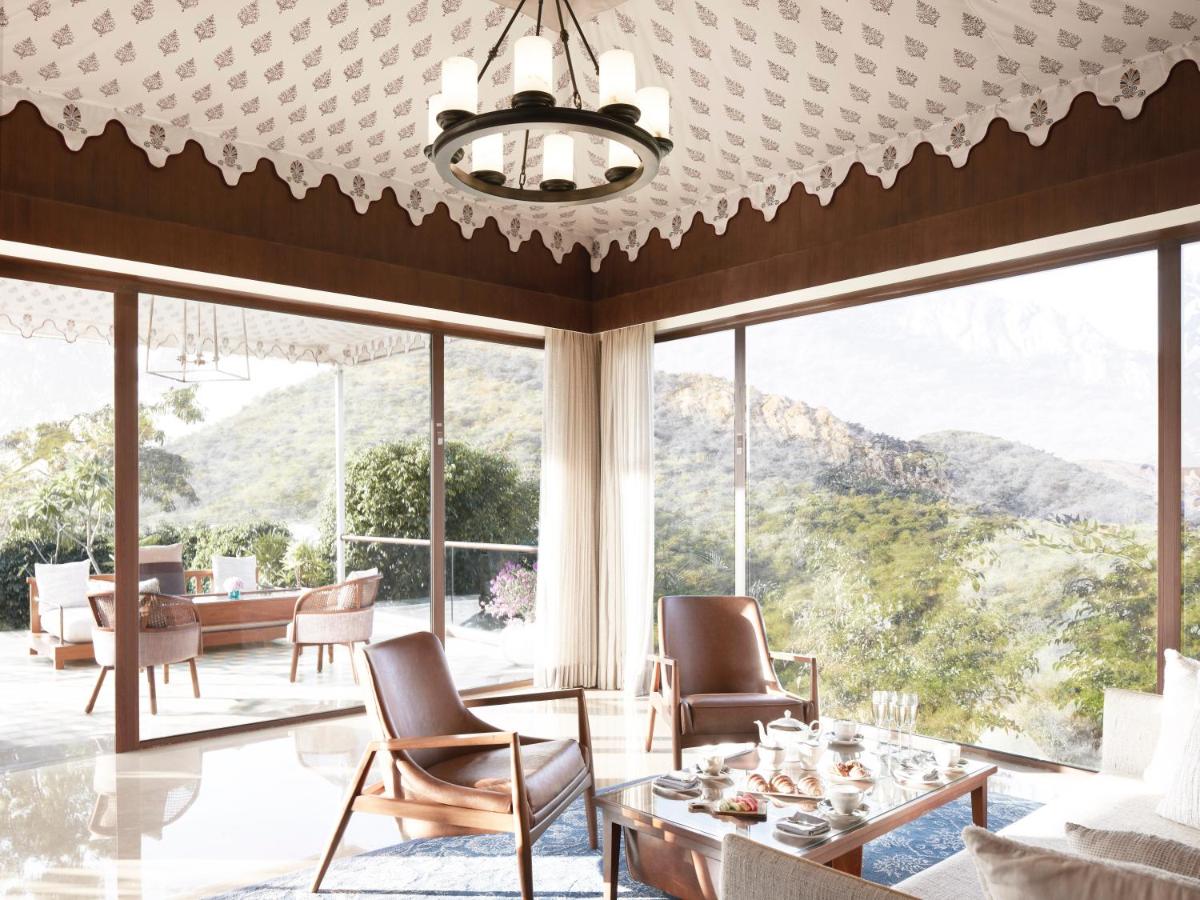a living room with a view of the mountains at Taj Aravali Resort & Spa Udaipur in Udaipur
