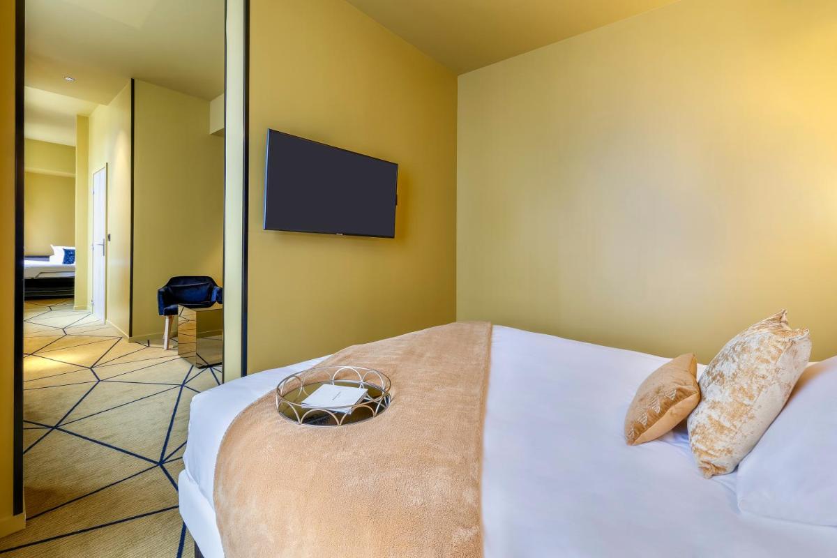 Un ou plusieurs lits dans un hébergement de l'établissement Hotel Leprince, Best Western Premier Collection