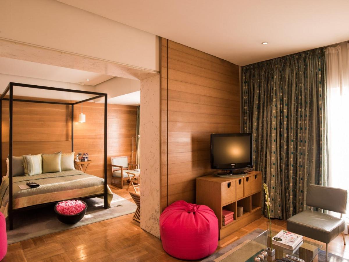 a living room with a couch and a television at The Park Bangalore, MG Road in Bengaluru a living room with a couch and a television at The Park Bangalore, MG Road in Bengaluru