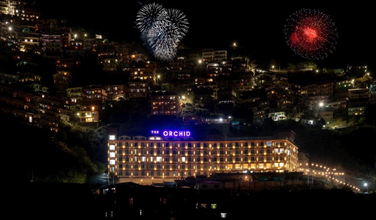 a night view of the opulent hotel with fireworks at The Orchid Shimla in Shimla