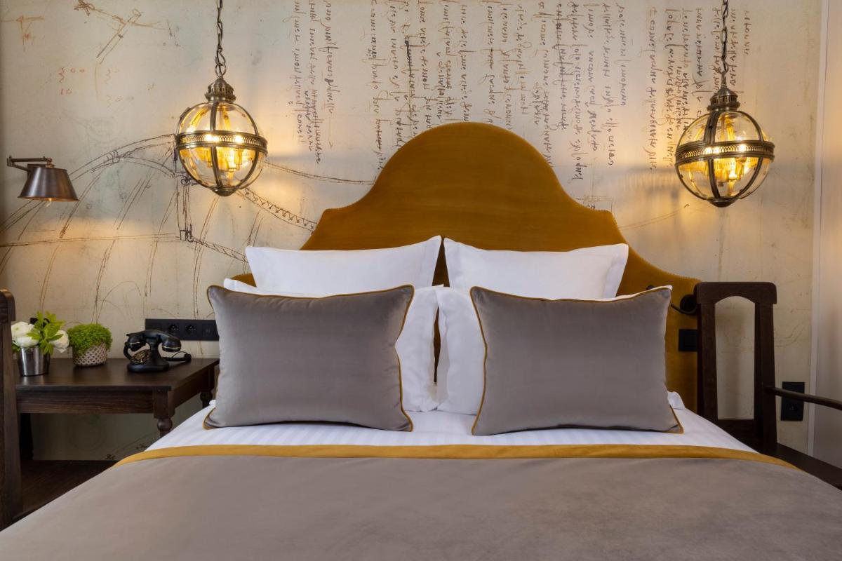 Un ou plusieurs lits dans un hébergement de l'établissement Hôtel & Spa Vinci Due
