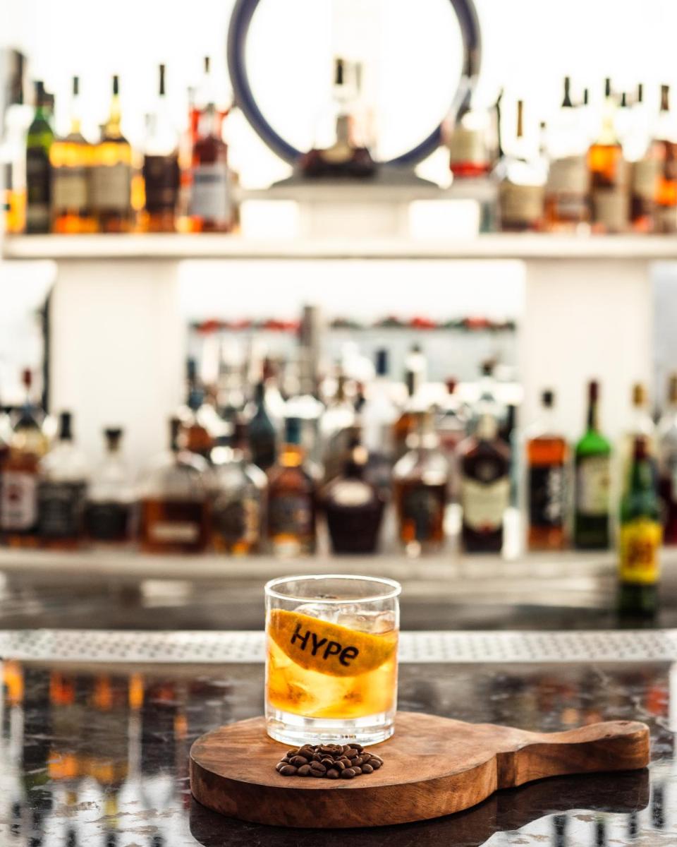 a glass of whiskey sitting on top of a bar at Shangri-La Bengaluru in Bengaluru a glass of whiskey sitting on top of a bar at Shangri-La Bengaluru in Bengaluru