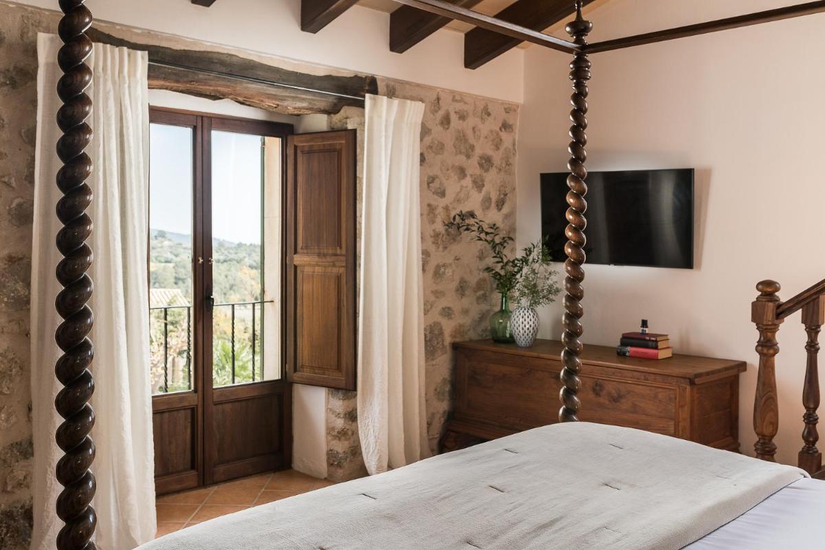Cama o camas de una habitación en Ca'n Beneït