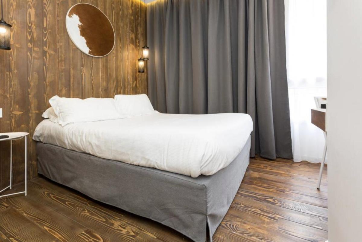 Un ou plusieurs lits dans un hébergement de l'établissement Atypik Hotel