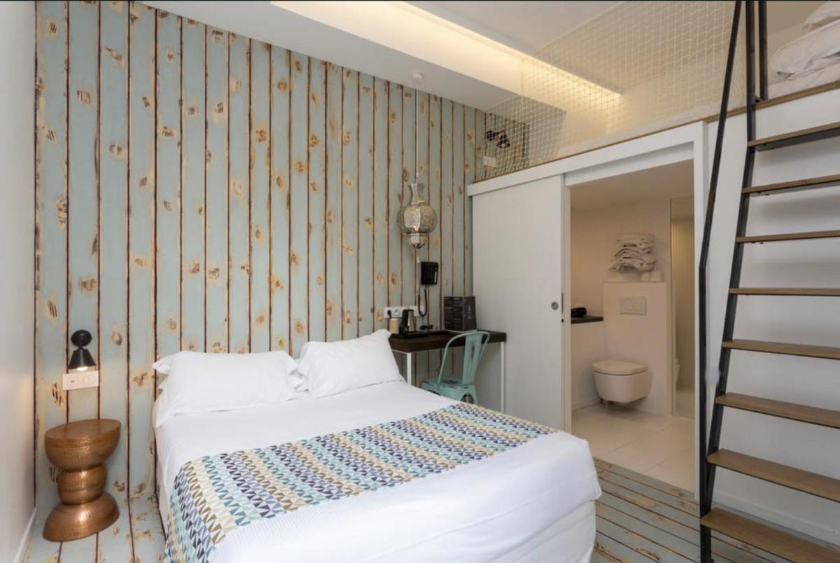 Un ou plusieurs lits dans un hébergement de l'établissement Atypik Hotel