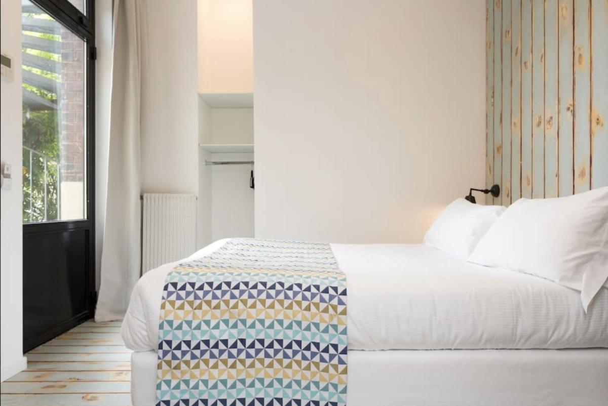 Un ou plusieurs lits dans un hébergement de l'établissement Atypik Hotel
