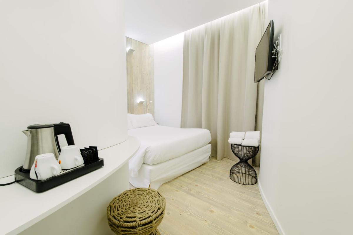 Un ou plusieurs lits dans un hébergement de l'établissement Atypik Hotel