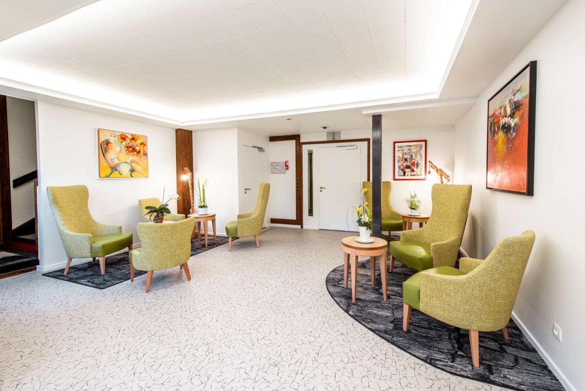 Coin salon dans l'établissement Best Western Plus Au cheval Blanc à Mulhouse