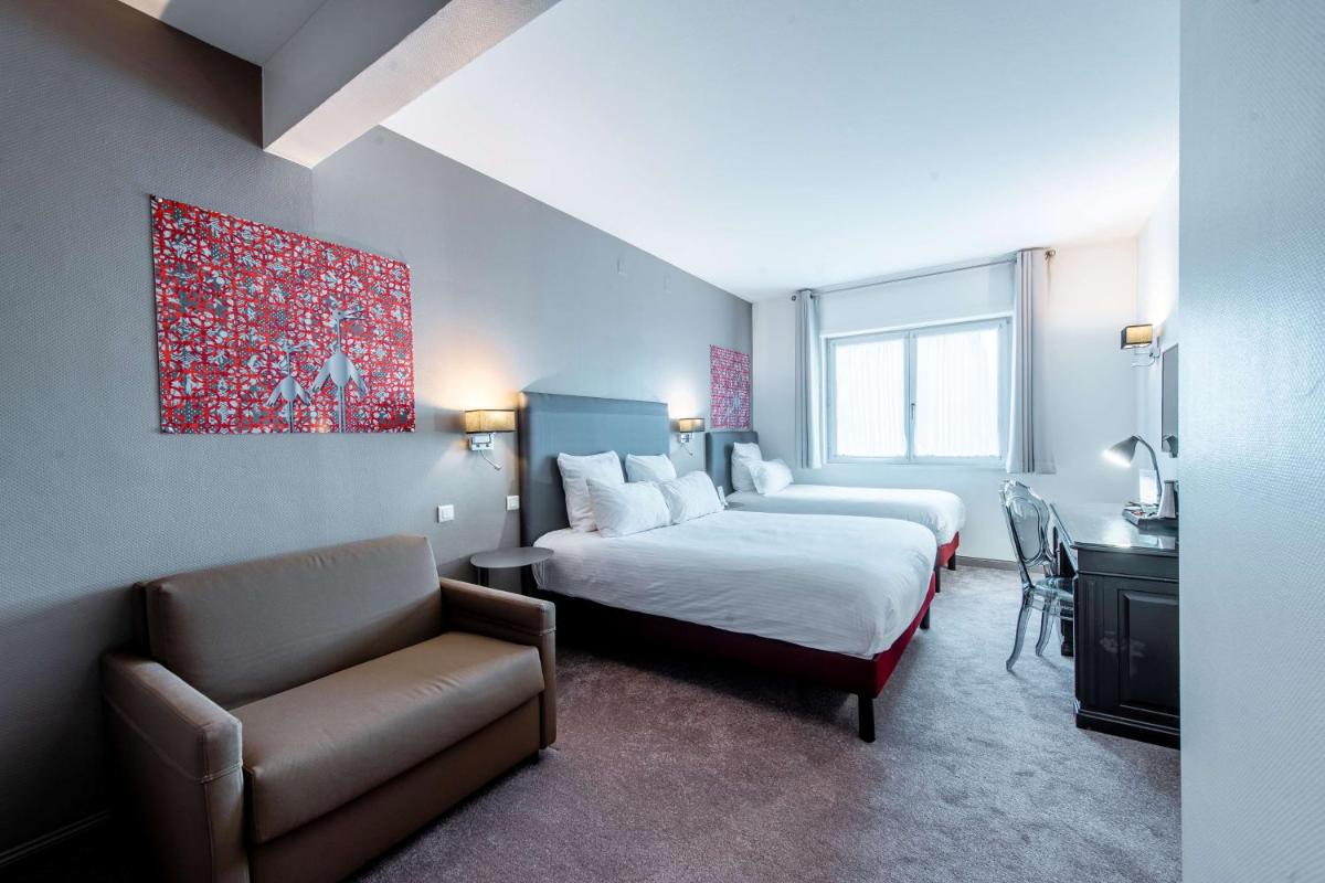 Un ou plusieurs lits dans un hébergement de l'établissement Best Western Plus Au cheval Blanc à Mulhouse