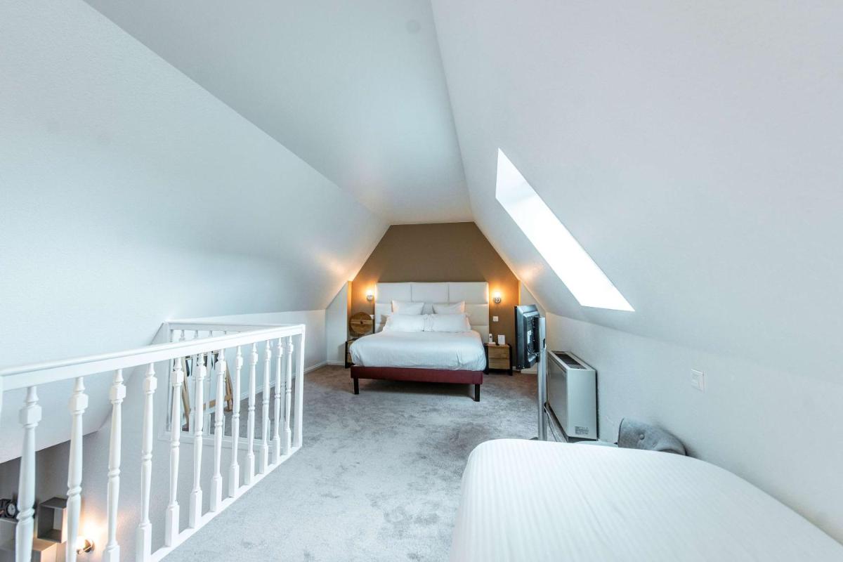 Un ou plusieurs lits dans un hébergement de l'établissement Best Western Plus Au cheval Blanc à Mulhouse