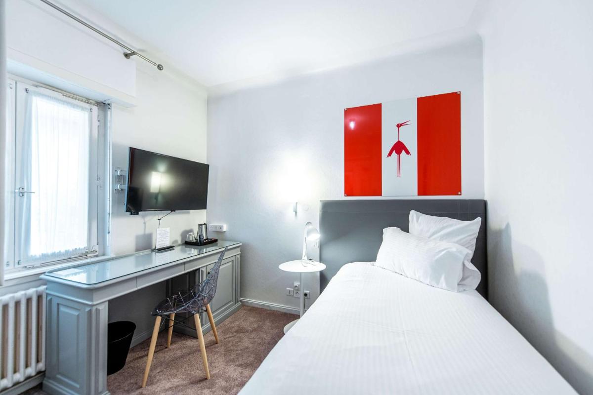 Un ou plusieurs lits dans un hébergement de l'établissement Best Western Plus Au cheval Blanc à Mulhouse