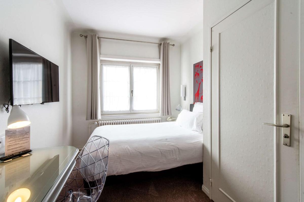 Un ou plusieurs lits dans un hébergement de l'établissement Best Western Plus Au cheval Blanc à Mulhouse