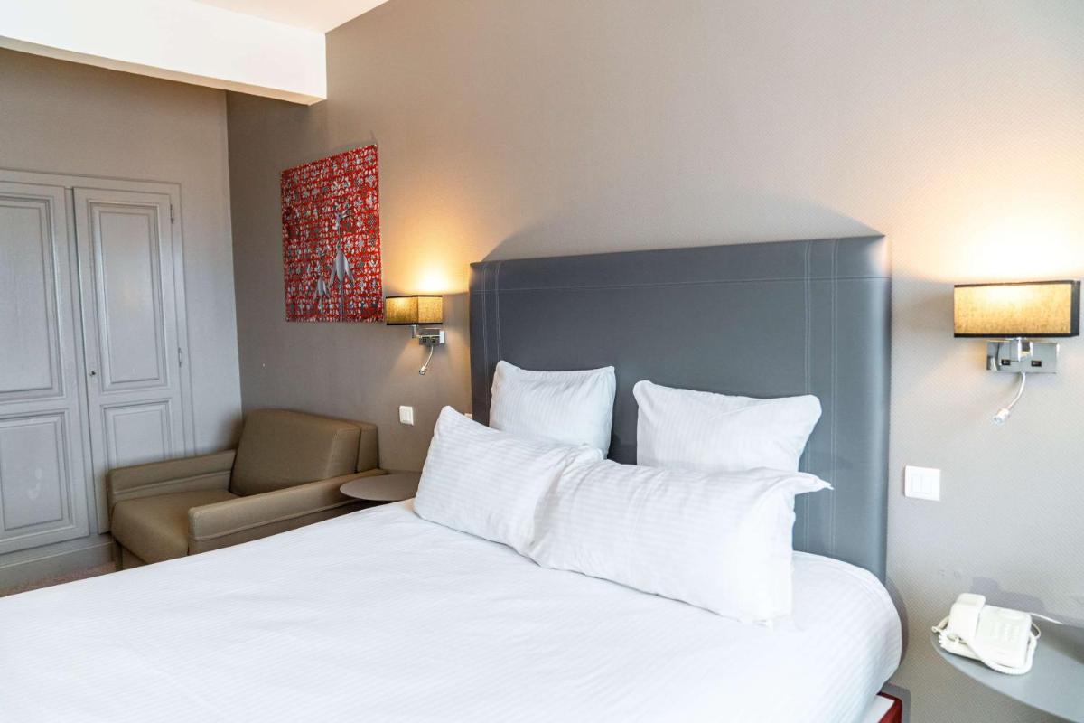 Un ou plusieurs lits dans un hébergement de l'établissement Best Western Plus Au cheval Blanc à Mulhouse