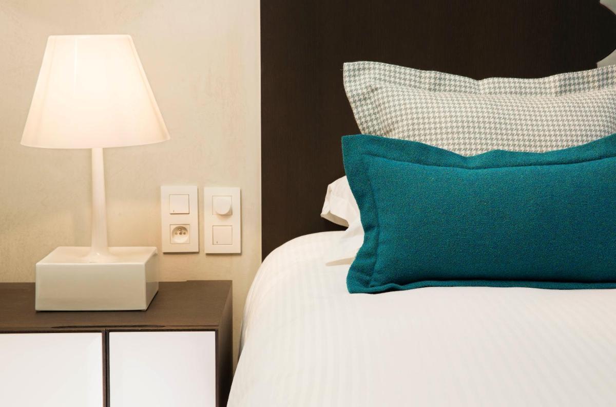 Un ou plusieurs lits dans un hébergement de l'établissement Hotel D - Strasbourg