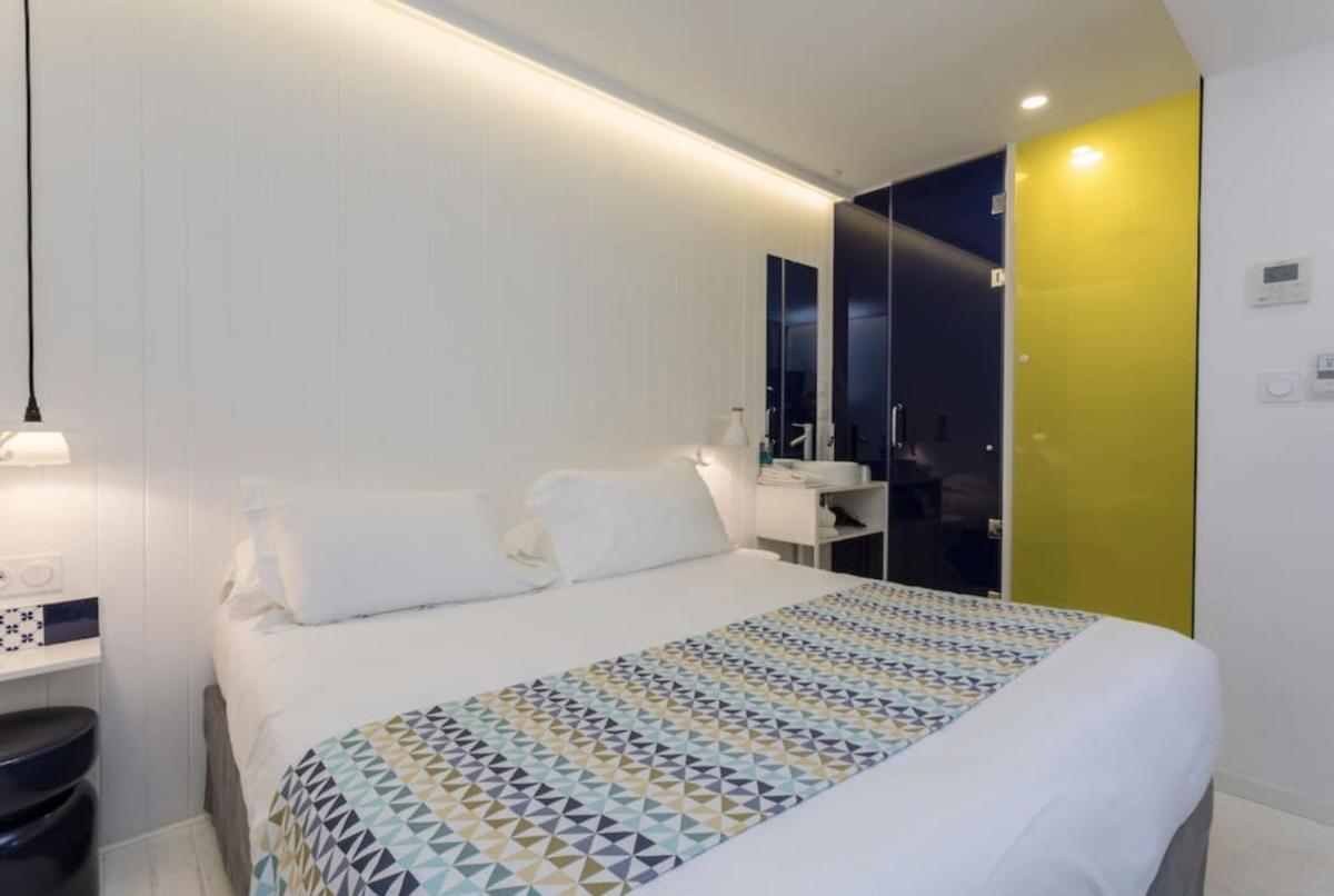 Un ou plusieurs lits dans un hébergement de l'établissement Atypik Hotel
