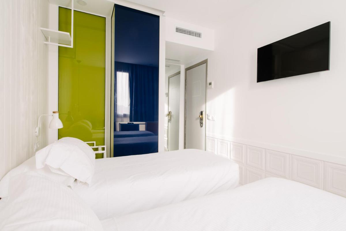 Un ou plusieurs lits dans un hébergement de l'établissement Atypik Hotel