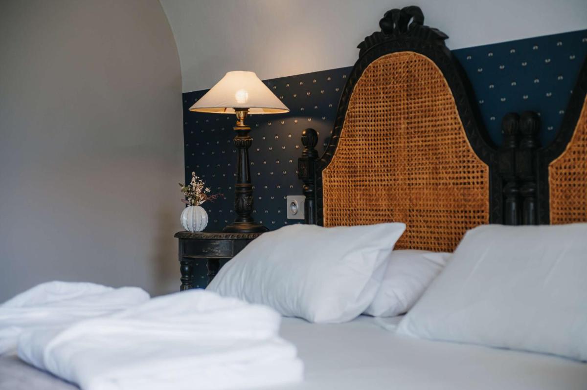 Un ou plusieurs lits dans un hébergement de l'établissement Hôtel La Robéyère - BW Signature Collection