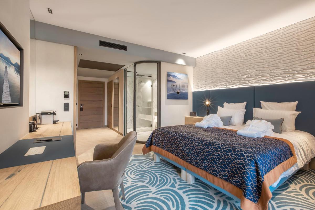 Un ou plusieurs lits dans un hébergement de l'établissement Rivage Hôtel & Spa Annecy