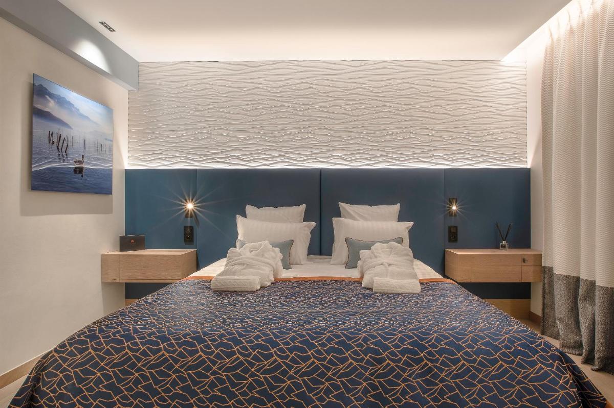 Un ou plusieurs lits dans un hébergement de l'établissement Rivage Hôtel & Spa Annecy