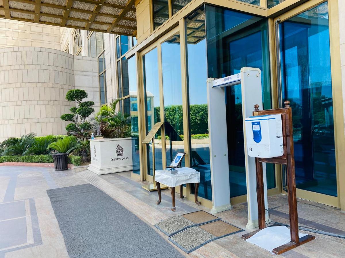 a payphone in front of a building at Seven Seas Hotel in New Delhi