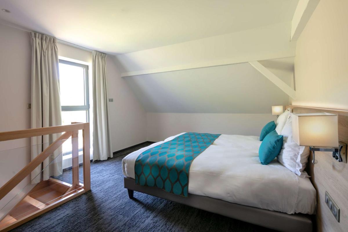 Un ou plusieurs lits dans un hébergement de l'établissement Best Western Plus Hotel & SPA Le Schoenenbourg