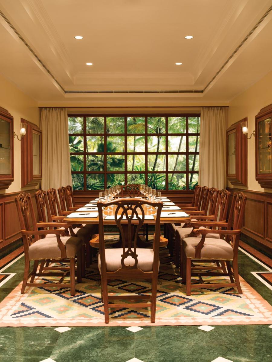 a large dining room with a table and chairs at The Oberoi Bengaluru in Bengaluru a large dining room with a table and chairs at The Oberoi Bengaluru in Bengaluru