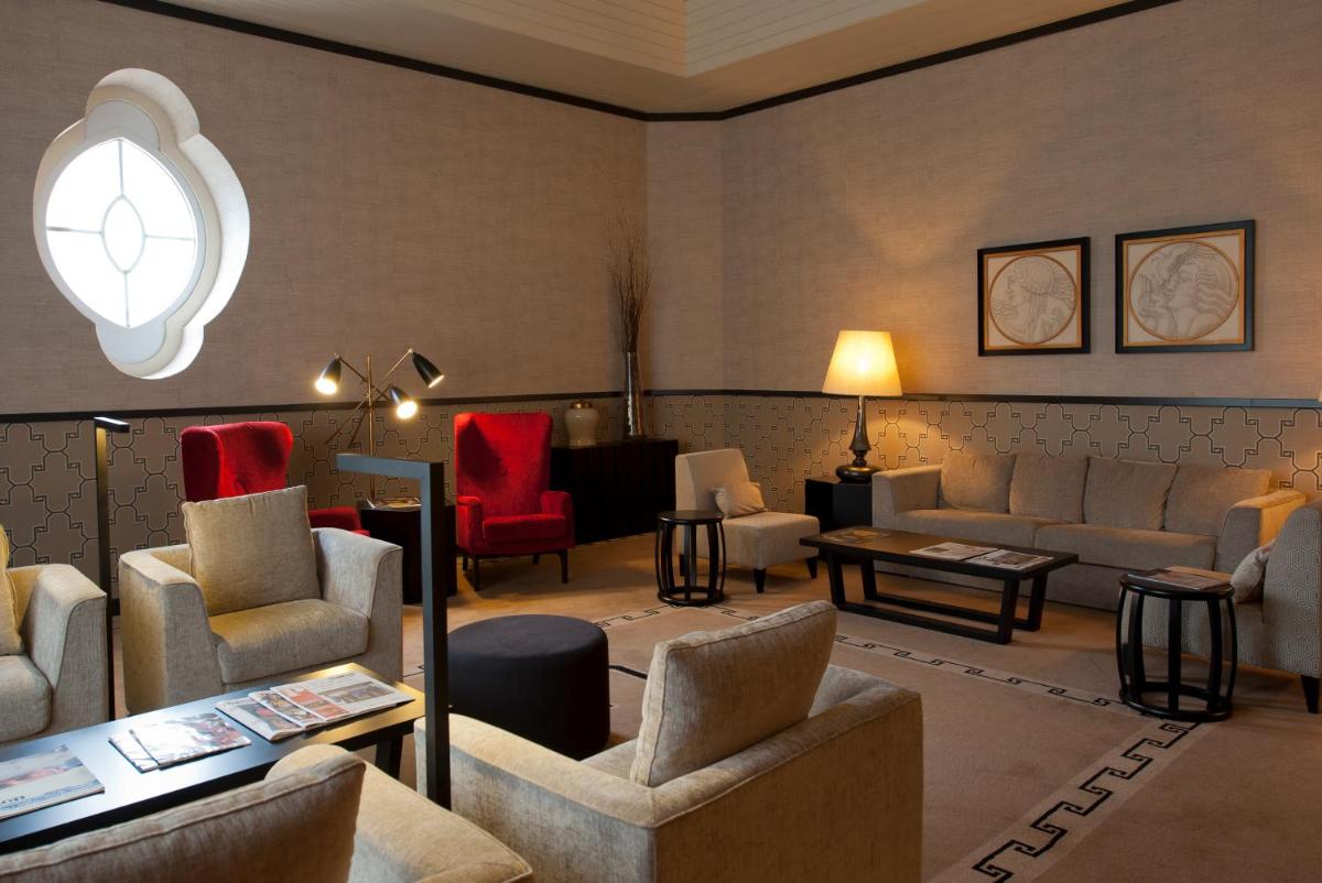 Uma área de estar em Grande Hotel De Luso