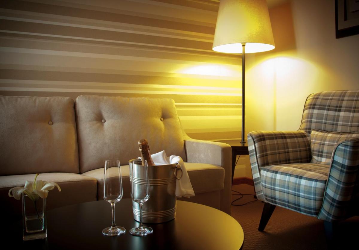 Uma área de estar em Grande Hotel De Luso