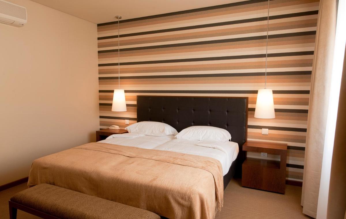 Uma cama ou camas num quarto em Grande Hotel De Luso