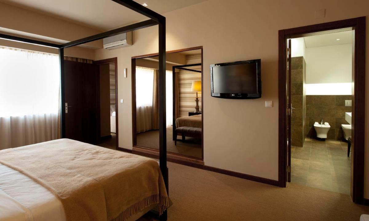 Uma cama ou camas num quarto em Grande Hotel De Luso