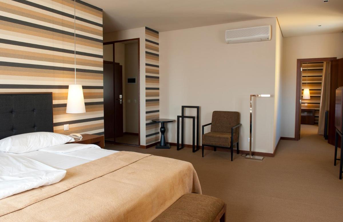 Uma cama ou camas num quarto em Grande Hotel De Luso
