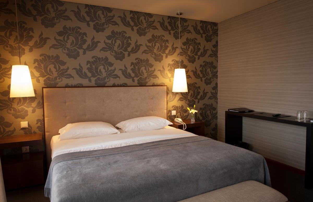 Uma cama ou camas num quarto em Grande Hotel De Luso