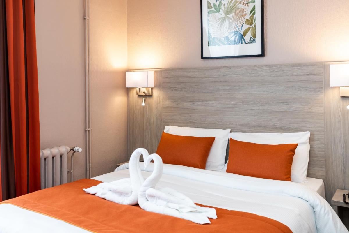 Un ou plusieurs lits dans un hébergement de l'établissement Hotel Regina & Spa
