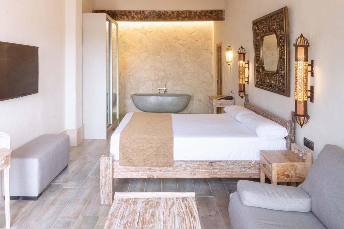 Cama o camas de una habitación en El Cortijo de Zahara by QHotels