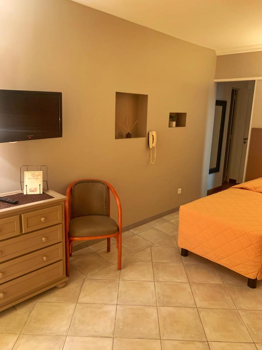 Un ou plusieurs lits dans un hébergement de l'établissement Hôtel Beau Soleil