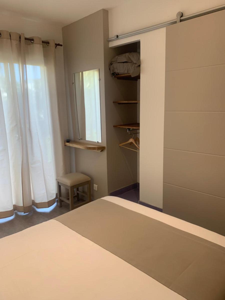 Un ou plusieurs lits dans un hébergement de l'établissement Hôtel Beau Soleil