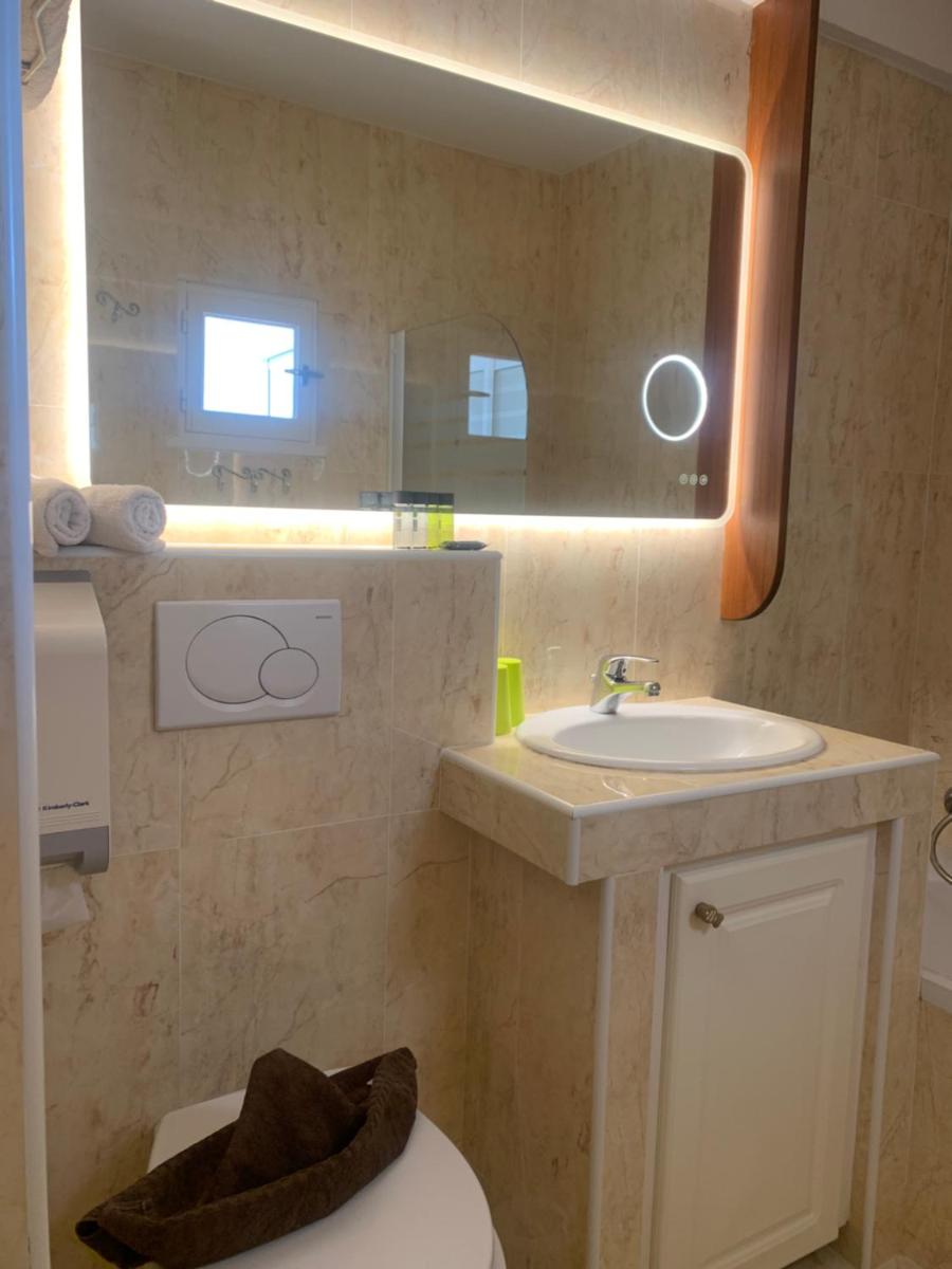 Salle de bains dans l'établissement Hôtel Beau Soleil