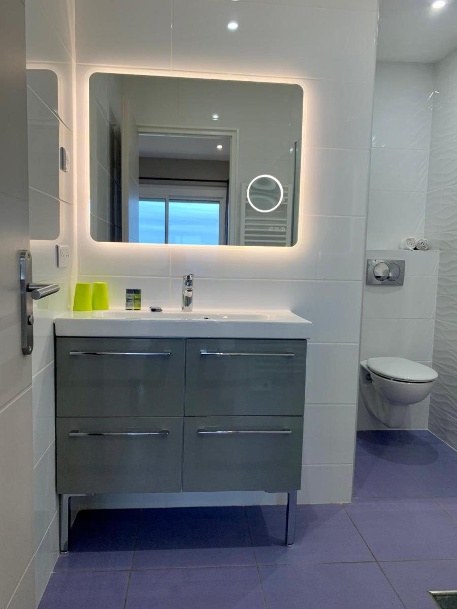 Salle de bains dans l'établissement Hôtel Beau Soleil