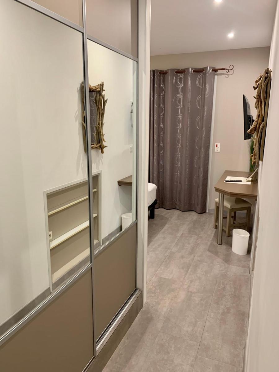 Salle de bains dans l'établissement Hôtel Beau Soleil