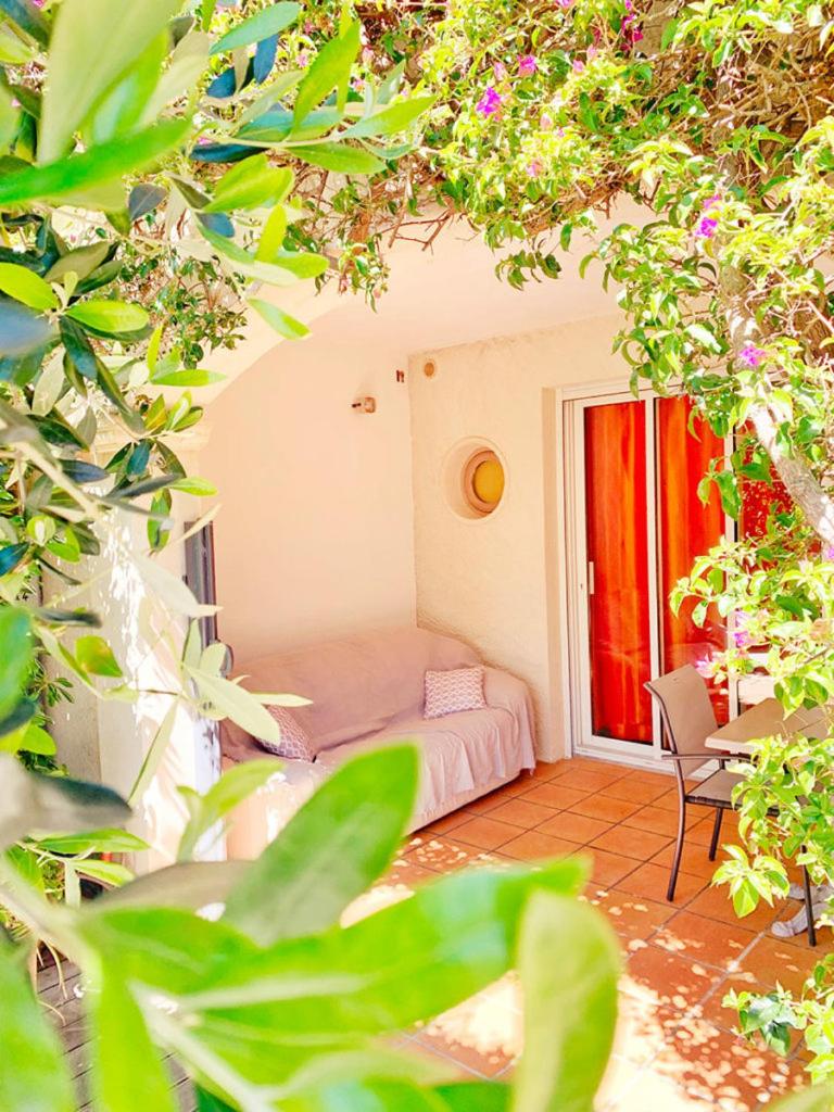 Un ou plusieurs lits dans un hébergement de l'établissement Hôtel Beau Soleil