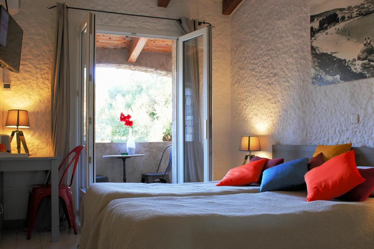 Un ou plusieurs lits dans un hébergement de l'établissement Hôtel Casa Rossa & Spa