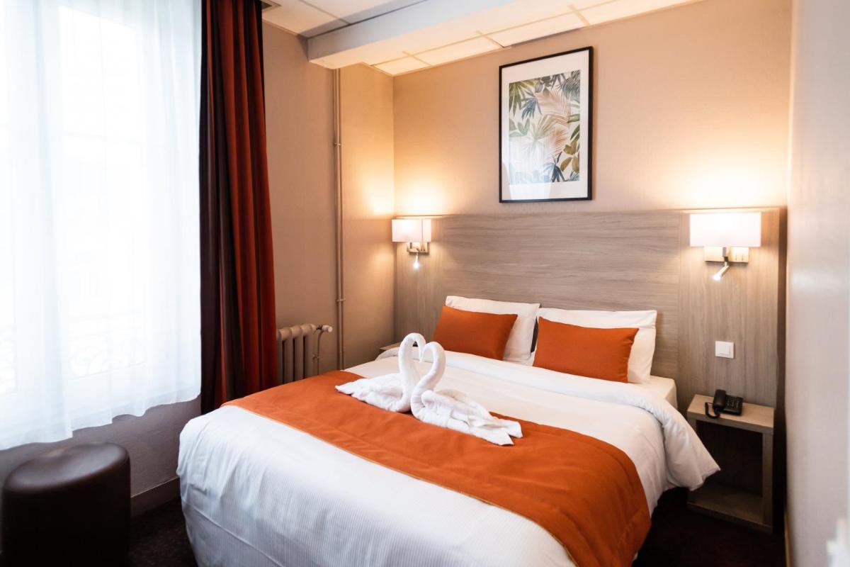 Un ou plusieurs lits dans un hébergement de l'établissement Hotel Regina & Spa