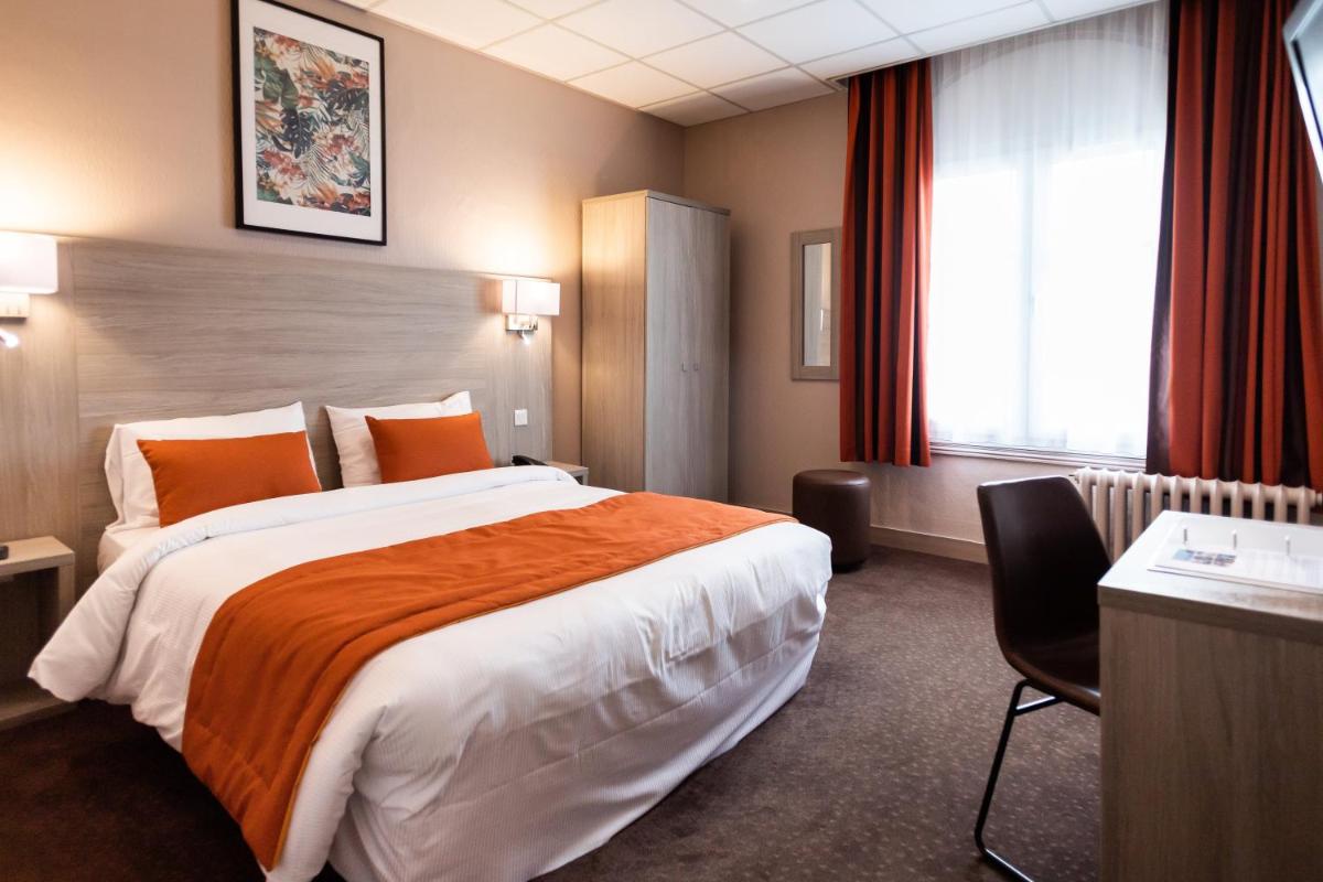 Un ou plusieurs lits dans un hébergement de l'établissement Hotel Regina & Spa