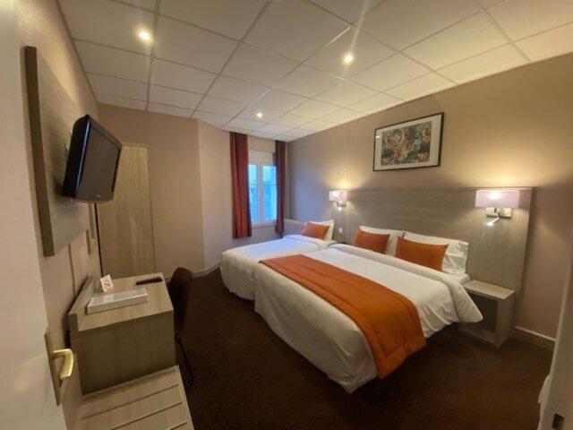 Un ou plusieurs lits dans un hébergement de l'établissement Hotel Regina & Spa