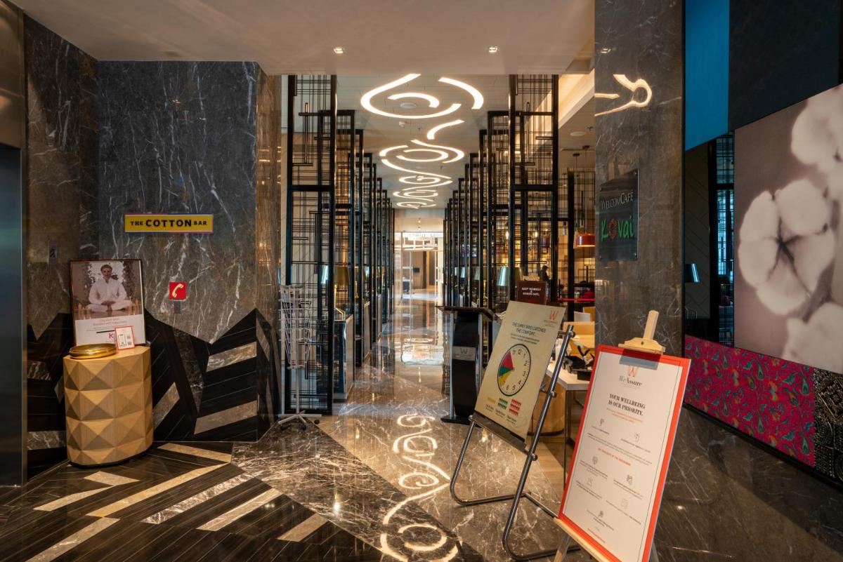 a lobby of a store with a sign on the floor at Welcomhotel by ITC Hotels, RaceCourse, Coimbatore in Coimbatore