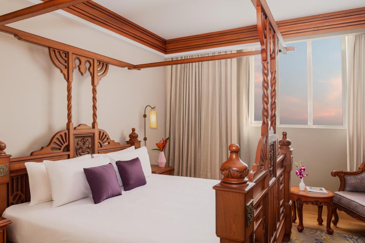 a bedroom with a canopy bed and a window at Vivanta Thiruvananthapuram in Trivandrum a bedroom with a canopy bed and a window at Vivanta Thiruvananthapuram in Trivandrum